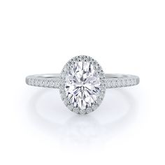 an oval cut diamond ring with pave set shoulders