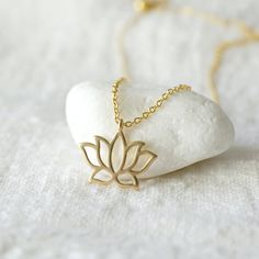 "Beautiful and lovely gold lotus flower charm necklace. Made of matte finish gold lotus flower charm with skinny gold plated brass chain. Soft and warm. Great for gift, everyday or special occasion. Your item will ship in a gift box. Please feel free to contact me if you have any question. ♥ Length 14\" - 20\" chain ♥ Lotus charm 1/2\" x 5/8\" ♥ Gold plated over brass ♥ See more Rudiana Accessories Rudiana.etsy.com" Pretzel Necklace, Gold Lotus Flower, Prom Necklaces, Gold Moon Necklace, Gold Lotus, Flower Charm Necklace, Gold Charm Necklace, Infinity Necklace, Gift Graduation