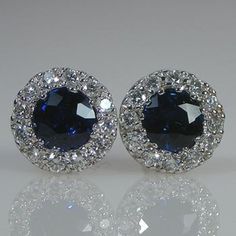 You will LOVE these little stud earrings.They are classic and chic. They are very petite style earring. The entire earring is 6.5mm wide in diameter. The blue sapphire color is beautiful and rich.The two center blue sapphire weight is .58 cts.The earrings are 6.5 mm wide.The diamonds are VS/G  Quality .18 cts total weight.The friction backs are 14k white gold.The TCW is .76 cts.The color combination of the bright white of the 18k white gold settings against the bright and intense color of the bl Luxury Sapphire Diamond Earrings With Brilliant Cut, Luxury Cluster Earrings With Vvs Clarity For Anniversary, Luxury Earrings With Halo Setting For Gift, Luxury Vvs Clarity Cluster Earrings For Anniversary, Luxury Diamond Earrings With Halo Setting, Luxury Cluster Earrings With Halo Setting As Gift, Classic Blue Platinum Earrings, Luxury Brilliant Cut Cluster Earrings As Gift, Formal Cluster Earrings With Matching Round Cut