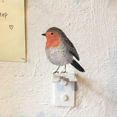 a bird painted on the side of a wall