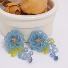 **Blue Flower-Shaped Beaded Handmade Earrings** Add a splash of color to your summer wardrobe with this  Blue Flower-Shaped Beaded Handmade Earrings. These vibrant, fun earrings are meticulously crafted to resemble delicate flowers, making them the perfect accessory for summer outfits and vacations. These earrings are not only eye-catching but also lightweight and comfortable to wear, ensuring you stay stylish all day long. Their playful design and bright blue hue bring a touch of whimsy to any Blue Dangle Flower Earrings For Spring, Blue Dangle Earrings For Spring, Blue Flower Earrings For Summer Party, Blue Beaded Dangle Flower Earrings, Blue Flower Earrings With Colorful Beads, Bohemian Blue Flower Earrings With Dangling Beads, Blue Flower Earrings For Spring Parties, Bohemian Beaded Flower Earrings For Spring, Light Blue Beaded Earrings For Party