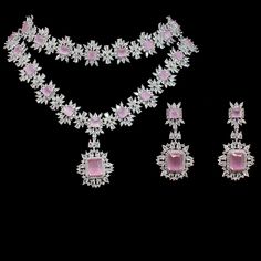 For edgy style and sophisticated sparkle, this necklace set is a dream come true! Elegant and shimmering set with CZ and pink stones creating a flawlessly fresh finish for each and every one of your evening ensembles. The set includes a choker paired with a necklace and a pair of beautiful earrings. Approximate earrings length is 2.1". Silver-plated on high-quality brass as base metal. Made by order. Kindly allow 5-7 weeks for the delivery of this item. For custom or urgent requests, please cont Luxury Pink Cutdana Jewelry, Diamond White Jewelry With Stone Setting For Party, Pink Jewelry Sets With Sparkling Stones For Wedding, Elegant Pink Rhinestone Jewelry Set, Cubic Zirconia Jewelry Sets With Stone Setting For Party, Pink Crystal Jewelry Sets For Formal Occasions, Elegant Pink Hand Set Jewelry Sets, Luxury Pink Crystal Jewelry, Formal Pink Crystal Jewelry Sets