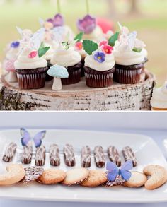 cupcakes and cookies are displayed on the table