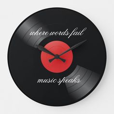 there is a clock with words on it that says, when words fail music speaks