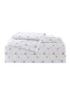 a white sheet set with blue stars on it