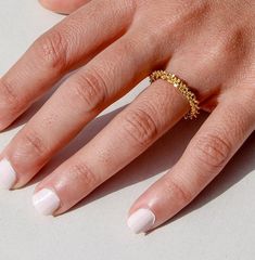 Introducing the adorable Halo Ring, your new favorite accessory that's as charming as it is chic! This darling minimalist layering ring is like a tiny treasure for your fingers, with its dainty design and 18K Gold Plated Chunky Statement style that adds just the right amount of sparkle to any look. Say hello to whimsy with its irregular shape, giving it a playful edge that's sure to catch eyes and hearts alike. Bold yet sweet, this ring is your go-to fashion sidekick, ready to make every outfit pop with its trendy flair. But wait, there's more! The Halo Ring is not just a pretty face - it's also waterproof and tarnish-free, meaning it can keep up with all your adventures without losing its shine. So whether you're splashing in puddles or dancing in the rain, this ring has got you covered! Trendy Yellow Gold Stackable Rings For Everyday, Trendy Tarnish-resistant Yellow Gold Stackable Rings, Trendy Yellow Gold Midi Rings For Everyday, Trendy Everyday Yellow Gold Midi Rings, Trendy Everyday Midi Rings Tarnish Resistant, Trendy Yellow Gold Stackable Rings For Gift, Trendy Yellow Gold Stackable Rings As Gift, Trendy Yellow Gold Midi Rings As Gift, Trendy Tarnish Resistant Stackable Rings For Gift