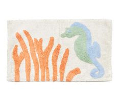 an orange and blue rug with a sea horse on it