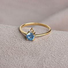 Aquamarine; It is also known as the stone of calmness and courage. The meaning of Aquamarine stone, which has a crystal structure, is sea water. Thanks to its blue color, it resembles streams and seas. Aquamarine is the birthstone for those born in March. Meet the essence of elegance: Solitaire aqumarine ring. Handcrafted with precision, this exquisite piece features a majestic sapphire set in a magnificent design. A symbol of timeless beauty, it embodies sophistication and elegance. Elevate you 14k Gold Solitaire Jewelry For Promise, 14k White Gold Topaz Birthstone Promise Ring, 14k Gold Solitaire Promise Jewelry, Heirloom Solitaire Birthstone Ring Gift, Heirloom Style Solitaire Birthstone Ring As A Gift, Promise Jewelry With Topaz Birthstone, Gold Diamond Ring With Blue Topaz In Round Cut, Fine Jewelry Topaz Birthstone Promise Ring, Topaz Birthstone Promise Ring Fine Jewelry