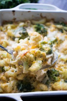 broccoli and cauliflower casserole with a spoon in it