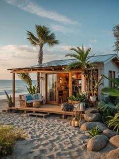 a small house on the beach with palm trees