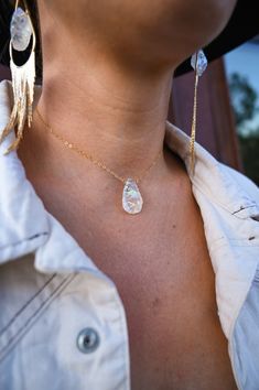 This necklace brings joy and good vibes to your world! When you put it on, you can feel it's high vibrational energy! Wear long, just below your neck, or as a choker. This is such a great layering piece to wear with other stone necklaces and our Wild & Free Girl earrings. The crystal pops with color in the light! Angel Aura Quartz crystal pendant Choose your chain, refer to listing image to see them~1.5mm 14k gold fill cable, 14k gold fill satellite, sterling silver cable, sterling silver satell Angel Aura Quartz Necklaces, Raw Crystal Pendant, Light Angel, Aura Quartz Crystal, Stone Necklaces, High Vibrational, Angel Aura Quartz, Quartz Crystal Pendant, Vibrational Energy