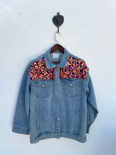 Vintage Banjara up-cycled denim Jacket One of a Kind Features banjara detailed fabric embroidered with Banjara folk art motifs The jacket you will receive will be the exact one in the photos. DRY CLEAN ONLY Garment Measurements- Shoulder - 23 inch Length - 27 inch Chest - 47 inch Sleeve - 20 inch  SIZE - Large Funky Denim Jackets, Vintage Patchwork Denim Jacket For Festivals, Bohemian Embroidered Denim Blue Outerwear, Bohemian Embroidered Blue Denim Jacket, Hippie Cotton Patchwork Denim Jacket, Embroidered Blue Button-up Denim Jacket, Outfit Vintage, Embroidered Jean Jacket, Bohemian Jackets