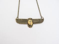 "Vintage design Egyptian Revival Scarab Pendant Necklace. Beautiful Antiqued brass. Ornate detailed Scarab, 2-3/8\" across. Antiqued brass finish brass chain with a lobster clasp. Handmade by me, on Maui, and sent to you with Aloha! #53 More of my Artisan Jewelry: hawaiibeads.etsy.com" Ancient Egyptian Necklace, Ancient Egypt Necklace, Winged Scarab Necklace, Scarab Pendant, Art Nouveau Brass Pendant Necklace, Oxidized Brass, Egyptian Revival, Art Deco Necklace, Swarovski Pearls