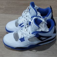 Introducing the Nike SAMPLE Air Jordan 4 IV Motorsports 2016 (308497-117) in Blue and White, designed for men who love basketball and style. This sneaker has a low top shoe shaft style and a tie closure, with a standard shoe width and a leather outsole material. The upper material is also made of leather, ensuring durability and comfort. The Air Jordan 4 model is a classic, and this 2016 release is a perfect addition to any sneaker collection. The royal theme and the iconic Jordan brand make this sneaker a must-have for any fan. This product is perfect for athletic activities, especially basketball. The shoe is manufactured in China and is available in UK Shoe Size 14, US Shoe Size 15, and EU Shoe Size 49.5. Air Jordans Blue And White, Blue And White Tennis Shoes, My Dream Shoes, Blue Jordans 4s, Blue Jordan 4’s, Dark Blue Jordans, Jordans Retro 4, Jordan Fours, 11s Jordans