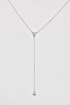 DETAILS MATERIAL 925 Sterling Silver Rhodium plated 18K Gold plated (1micron) SIZE: Zircon CHARM - approx. 5mm/0.20in Zircon drop - approx. 8.5cm/3.5in CHAIN: Trace chain with extender can be worn at 15in/38cm, 16in/41cm and 17in/43cm DESCRIPTION: Minimalist and timeless, this dainty cz lariat necklace is the perfect finish to your outfit. The necklace features slender chain in a sleek Y shape with 2 mini cubic zirconia charms. The zircon drop is approx 8.5cm/3.5 inches. The necklace fastens wit Adjustable Y-shape Clavicle Chain Drop Necklace, White Gold Lariat Necklace With Delicate Chain, White Gold Lariat Chain Necklace, White Gold Delicate Lariat Necklace, Fine Jewelry Lariat Necklace With Clavicle Chain, Dainty White Gold Lariat Necklace With Delicate Chain, Clavicle Chain Y-shape Drop Necklace, Adjustable Y-shape Lariat Necklace, Fine Jewelry White Gold Pendant Lariat Necklace