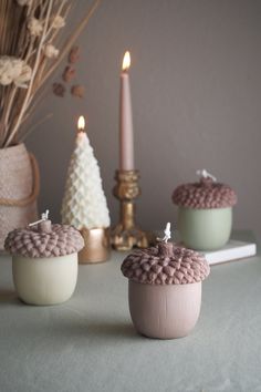 "HANDMADE! MADE TO ORDER! The Acorn-shaped candle, a symbol of nature's bounty, invites us to embrace the autumnal spirit, inviting us to slow down and appreciate the fleeting moments of this magical season. Ingredients:  Pure Soy Wax, Natural White Beeswax, Cotton Wick, Premium Fragrance oil, Candle Dyed Color:  Ivory (undyed), Castle Beige, Moss Green Dimension:  3.75\" W x 4\"H Weight:  14.1oz (400g) Scent Note:  Cypress, Pine, Eucalyptus, Mint, Tonka Bean, Smoke Made in the USA NOTICE Each one is handmade and wrapped by hand, and due to the nature of this, they may vary slightly, some small imperfections may be present, which does not affect the use. ABOUT SHIPPING Made just for you. Candles take 3-5 business days to make. Ready to ship in 1 week. BURNING INSTRUCTIONS 1. THE MOST IMPOR Fall Candle Ideas, Christmas Candle Crafts, Fall Scented Candles, Autumn Candles, Decoration Candles, Cypress Pine, Christmas Candles Diy, Thanksgiving Candles, Shaped Candles