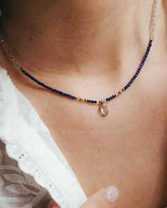 Our lapis lazuli gold choker with tiny lapis lazuli beads, labradorite and blue topaz pendant and gold accents. Ideal to wear in summer, this navy blue necklace looks amazing with its matching bracelet and in any summer event, next to the beach and lighted by the sun. This gold necklace with small blue gemstone beads is perfect as a September or December birthstone gift, when the lapis lazuli crystal takes on even more significance.  ** D E T A I L S ** Gemstones size we use are lapis lazuli and labradorite 2mm beads and blue topaz pendant 7mm. Materials: lapis lazuli, labradorite and blue topaz gemstones, 18k gold plated chain and gold plated extender.  Gemstones we use in our necklaces may have some slight variation of tone. Every natural stone is special and unique, that's the idea! ** Elegant Handmade Lapis Lazuli Crystal Necklaces, Gold Labradorite Gemstone Beaded Necklace, Elegant Handmade Lapis Lazuli Crystal Necklace, Delicate Blue Birthstone Jewelry, Lapis Lazuli Beaded Necklace With Faceted Beads For Gift, Elegant Lapis Lazuli Crystal Necklace With Gemstone Beads, Sapphire Colored Lapis Lazuli Round Bead Jewelry, Sapphire-colored Lapis Lazuli Round Beaded Jewelry, Bohemian Sapphire Gemstone Beads Jewelry