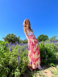 Say "summer vibes" in style with these classic wide-leg tie dye pants! Featuring a cool tie dye indigo color, pockets and a drawstring waist, these pants are perfect for all your summer adventures. Ready, set, slay! Team with a cool crop and your favorite tee, so you can wear it at home, on the beach, or your next party! Available in 3 colors. Features: Handmade Tie-dye Lightweight feel Very comfortable Elastic waistline Breathable Pockets Wide-leg Size + Fit: Model height is 165cm/5.5ft, Americ Pink Bohemian Maxi Bottoms, Pink Bohemian Maxi Length Bottoms, Bohemian Pink Maxi Bottoms, Breezy Maxi Length Summer Bottoms, Flowy Bottoms For Summer Vacation, Breezy Maxi Length Bottoms For Summer, Breezy Maxi Summer Bottoms, Summer Maxi Bottoms For Day Out, Bohemian Summer Bottoms For Day Out