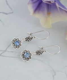 These flower pattern earrings are handmade from high-quality 925 sterling silver and feature a stunning design with double-sided faceted gemstones in your choice of Amethyst, Blue Topaz, Blue Quartz, or Citrine. The earrings are both oxidized and highly polished, giving them a unique, antique-inspired look that is both elegant and timeless. The earrings are designed to dangle delicately from the earlobes, making them a beautiful and eye-catching accessory that is perfect for special occasions or Gemstone Flower Drop Earrings For Gift, Sterling Silver Gemstone Flower Earrings For Gift, Blue Round Flower Earrings In Sterling Silver, Silver Gemstone Flower Earrings, Blue Sterling Silver Flower Earrings For Pierced Ears, Blue Sterling Silver Flower Earrings Nickel Free, Sterling Silver Gemstone Flower Earrings, Nickel-free Blue Sterling Silver Flower Earrings, Blue Sterling Silver Earrings For Her