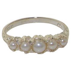 This stunning ring is made from 14K White Gold fitted with Cultured Freshwater Pearls. Beautifully Handcrafted from Solid English 14K White Gold and Tested and Hallmarked by the London Assay Office. The Hallmark includes the 585 marking plus the Leopard's Head and the Royal Crown. The Pearls are Freshwater Cultured Pearls that are hand selected and hand set. The pearls measure 4 mm, 3 mm & 2.75 mm (0.16",0.12" & 0.11" inches) If you know your US, UK, Australian or European Finger Size then please include this as a note attached to your order otherwise we will work to the size you have selected. CUSTOMIZE THIS RING This ring can be customized to your requirements - 9K, 10K, 14K, or 18K in Yellow, Rose or White Gold or Platinum and whatever stone combination you would like. If I don't have t Pearl Rings Vintage, Vintage Wedding Ring, Pearl Vintage, Half Eternity Band, Wedding Rings Vintage, Freshwater Cultured Pearls, Cute Rings, Future Life, Eternity Band