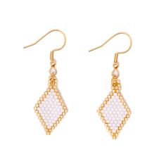 This elegant Azalea earring is artfully crafted for tasteful sophistication. Boasting a small, diamond-shaped design made of gold and white Miyuki glass beads, this unique piece of jewelry will add a touch of class to any look. Handmade with meticulous attention to detail, Azalea is sure to be the perfect accent for your style. Lifestyle Posing, Family Support, Jewelry Workshop, Touch Of Class, How To Speak Spanish, Sell Handmade, Seed Bead, Diamond Shapes, Seed Beads