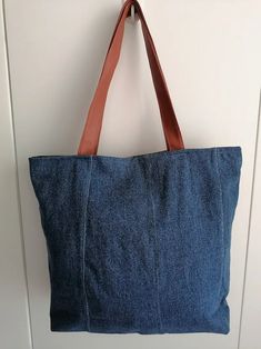 a denim bag hanging on the wall