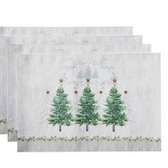 three placemats with christmas trees on them