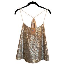 Sold By American Threads Boutique Brand: Alythea Gold Sequin Trapeze Tank Racerback Formed By 2 Silky Spaghetti Straps(Not Adjustable) Unleash Your Inner Disco Queen In This Modern Take On A Classic Studio 54 Ensemble. Style Under A Blazer For Work Or W/Your Fav Mini & Faux Fur Coat For A Glamorous Date Night Look. This Cut Is Super Flattering! Front&Back Covered In Sequins Straps/Lining Satin(Poly) Approx Meas. Pit-Pit: 18.25” Unstretched (21.5”) L: 22.5” Imo Fits Us 6-10 Depending On How You W Glamorous Sleeveless Top With Built-in Bra, Sequin Halter Neck Top For Summer, Summer Halter Neck Top With Sequins, Summer Sequin Halter Neck Top, Summer Sequin Spaghetti Strap Tank Top, Summer Tank Top With Sequins And Spaghetti Straps, Sequin Spaghetti Strap Camisole For Spring, Spring Sequined Spaghetti Strap Camisole, Spring Camisole With Sequins And Spaghetti Straps