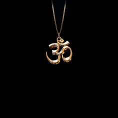 Connect with the sacred sound of the universe with our gold Om pendant, finely crafted in the USA. Representing the essence of ultimate reality, consciousness, and inner peace, each piece is a harmonious blend of spirituality and artistry. PENDANT INFORMATIONThis pendant is made of real, solid gold.• Made in USA• Size: MINI• Material: 14k or 18k solid gold• Finish: polished• Height: 0.9" (22,5 mm) x Width: 0.85" (22 mm)• Pendant weight (approx.): 3,5 grams (14k)• Bail: fits up to 4 mm chains• So Symbolic Bronze Necklace For Meditation, Symbolic Necklaces For Meditation And Festivals, Spiritual Ceremonial Jewelry With Round Pendant, Spiritual Round Pendant Jewelry For Rituals, Spiritual Large Pendant Jewelry For Rituals, Symbolic Jewelry For Festivals, Symbolic Ceremonial Jewelry For Festivals, Symbolic Jewelry With Large Pendant For Healing, Symbolic Round Pendant Jewelry For Meditation