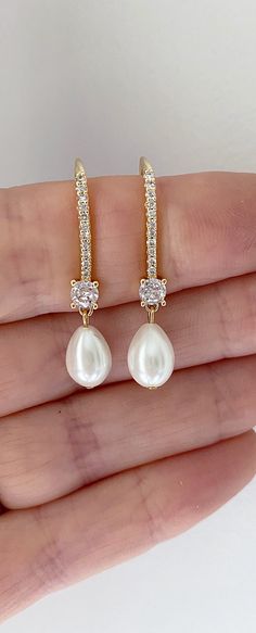 Our pearl drop bridal earrings are simply stunning! A simple classic earring. Little bit of bling, classic pearl, small drop... perfect combo! These long pearl drop earrings catch the light, packing serious sparkle for their size. Combining marquise crystals stones they're finished with glowing pearls. With just the right amount of sparkle, this dainty pair is perfect for brides, mother of the bride and bridesmaids alike. -Drop Pearls are light ivory- These Crystal and pearl wedding earrings will add a flawless finish to every bridal look. ** Delivery is 3 Weeks ** SHOP MORE STYLES https://www.etsy.com/ie/shop/BridalStar?ref=related&listing_id=768478002# *RETURNS- We accept returns . ** Bridal Jewelry Pearl Earrings, Diamond And Pearl Earrings, Bridal Jewelry Gold, Brides Mother, Bridal Jewelry Pearl, Elegant Pearl Jewelry, Jewelry Pearl Earrings, Bridal Drop Earrings, Gold Bridesmaid Jewelry