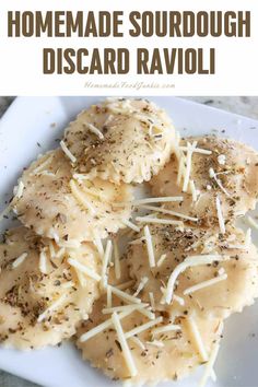 homemade sourdough disard ravioli on a white plate with parmesan cheese