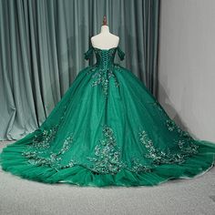 This Luxury Green Organza Quinceanera Dress Ball Gown is a vision of elegance. With a fitted corset-style bodice adorned in glittering emerald green beaded florals, it offers an effortlessly glamorous look. The full ball gown skirt boasts a ruffle detail and delicate bead work, leading to a back train and lace-up back for easy adjustability. Perfect for a statement-making Quinceanera dress. material: organza type: ball gown style: formals color as shown built in bra sweetheart neckline train as shown lace up back Quinceanera Stuff, Fitted Corset, Luxury Green, Makeup Images, Mini Wedding Dresses, Dress Ball Gown, Gown Skirt, Gown Style, Green Dresses