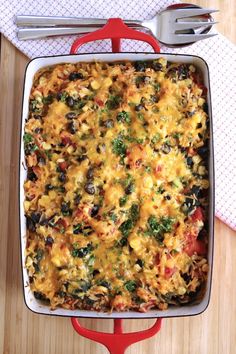 a casserole dish with broccoli, cheese and black beans in it