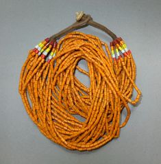 This ethnic necklace with 20 strands orange glass beads originates from the Naga.  The hanging length of the necklace is 28 cm. The average diameter of the beads is 0.3 cm.  Its weight is 203 gram. (s30) SHIPPING SHIPMENT is FREE. All items are shipped every week on monday morning after receipt of payment. We send priority airmails. Please consider overseas shipments take usually 5 - 8 days. Insured packets (over 50 cm length / over 1500 gram) I send by standard way. PAYMENT Paypal is preferred. Orange Bohemian Hand-strung Beaded Necklace, Bohemian Orange Beads For Jewelry Making, Hand-strung Orange Bohemian Beads, Bohemian Hand-strung Orange Beads, Vintage Orange Beaded Necklace For Festival, Orange Vintage Beaded Necklace For Festival, Bohemian Orange Hand-strung Necklace, Traditional Orange Multi-strand Jewelry, Orange Large Beaded Necklace For Festivals