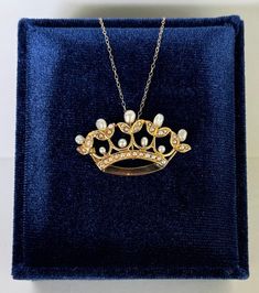 Absolutely Gorgeous Crown Pendant Necklace finely crafted in 14 karat yellow gold. Its exquisite detailing showcases a floral design crown adorned with a pearls. The pearls are carefully set within the gold framework which provides a delicate and lustrous touch to the design. These pearls add a subtle shimmer, contributing to the "brooch" now Pendant overall elegance, once secured with a pin catch closure, we removed and now has a hidden bale to wear as a necklace.  ERA - Circa 1890s - Victorian Era METAL / MATERIAL - 14k yellow gold, Cultured Pearls, Seed Pearls, 14k yellow gold chain MARKINGS / HISTORY - Pendant has been professionally tested CONDITION - Excellent vintage condition. Gold metal has been polished & cleaned.All pearls are secure. Amazing crown conversion pendant necklace. S Victorian Gold Pearl Necklace For Gift, Ornate Yellow Gold Jewelry With Pearl Pendant, Victorian Yellow Gold Pendant Locket Necklace, Victorian Yellow Gold Necklace With Pearl Pendant, Victorian Enamel Yellow Gold Necklace, Crown Pendant Necklace, Crown Pendant, Seed Pearl, Pearl Pendant Necklace