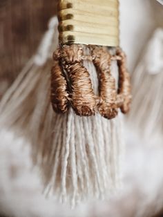 These light weight statement earrings are composed of handmade beige fringe tassels with vintage hand dyed lace and pure brass metal components. A boho tassel earring that is authentically unique. The lace trimming comes in black, white, terracotta (rusty brick), mustard (ochre yellow), beige (sand), Desert rose (dusty pink), magenta (beetroot pink), burgundy (red wine), navy (dark blue), teal (dark turquoise), evergreen (dark emerald) or Dark moss (army green). --------------------------------- Brown Bohemian Tassel Earrings, Bohemian Brown Tassel Earrings, White Bohemian Fringe Earrings, Bohemian Beaded Tassel Earrings For Beach, Brown Fringe Tassel Earrings For Festivals, White Fringe Tassel Earrings For Festivals, Bohemian Beige Earrings For Beach, Elegant Fringe Tassel Earrings For Beach, Bohemian Macrame Tassel Dangle Earrings