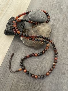 This Brown Agate Mala necklace has a brownish tone that will be easy to match your everyday outfits and keep you calm and grounded if you use it while meditating. Its a unique decor item also. A perfect gift for a yoga lover, or someone that loves stones. You can use it as a necklace or wrap it around the wrist and becomes a bracelet. The Mala necklace has a drop length of 42cm- 16.5 inch. A most have addition to your jewelry collection. ⚡️Join Akashi's VIP list for early bird discount access⚡️ Wiccan Necklace, Yoga Lover Gift, Natural Opal Ring, Brown Agate, Mens Gemstone Rings, Karma Necklace, Mens Necklace, Rare Stone, Protection Necklace