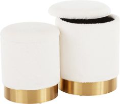 two white and gold covered stools sitting next to each other on a white background