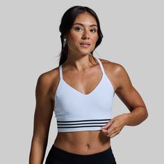 Our Level Up Sports Bra was created to truly feel like a second skin. To deliver just that, we started with a seamless design that delivers unmatched comfort while hugging your body without restricting your movement. Then, we used a moisture-wicking and breathable fabric to keep you comfortable when working up a sweat and finished it off with an extended body for added coverage when wearing on its own. Athletic Fit Activewear With Built-in Bra For Training, Sporty Athletic Fit Sports Bra For Yoga, Sporty Supportive White Activewear, Supportive White Go-dry Activewear, White Stretch Activewear For Training, Functional White Activewear For Workout, Supportive Sports Activewear With Built-in Bra, Functional White Sports Bra For Workout, White Fitted Activewear For Gym