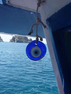 a blue object hanging from the side of a boat