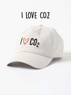 This is a playful and thought-provoking image that proudly declares "I love CO2."  This image challenges perceptions and encourages a deeper understanding of the complexities surrounding climate change and carbon emissions. Whether sparking light-hearted banter or prompting meaningful discussions, "I love CO2" is a whimsical reminder that every aspect of our world deserves consideration and exploration. Double Wide, Our World, Hat Sizes, Street Style Women