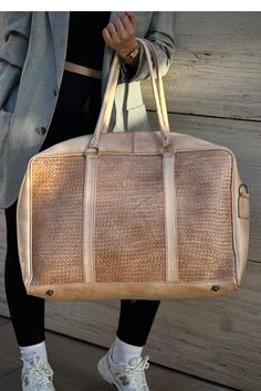 Unleash style on the go with our Classy Duffle Bag. Handwoven to perfection, it's a statement of modern luxury for the discerning traveler. Modern Rectangular Cases For On-the-go, Beige Weekender Bag For On-the-go, Modern Weekender Bag With Top Carry Handle For Trips, Classic Travel Crossbody Box Bag, Classic Crossbody Travel Box Bag, Classic Crossbody Box Bag For Travel, Luxury Travel Box Bag With Large Capacity, Brown Travel Bag With Top Carry Handle, Tote Shoulder Bag With Luggage Sleeve For Weekend Trips