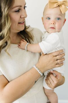 A bright white bead that sparkles like the snow in sunshine. Glacier is the ultimate neutral bracelet. The perfect accessory for every Mom + her mini! Made with the highest quality materials, this bracelet will look beautiful for years to come. Durable enough for play, precious enough to keep forever. Materials: 14k gold filled or sterling silver components. Nickel free. To learn more about our materials and what makes gold filled unique read here. Features: Each bracelet has a ½” extender chain Adjustable White Bracelet For Everyday, White Beaded Bracelets For Everyday, Everyday White Beaded Bracelets With Tiny Beads, Everyday White Beaded Jewelry, White Stretch Bracelet With 8mm Beads, Everyday White Beaded Bracelets With Round Beads, Minimalist Pearl White Beaded Bracelets For Everyday, Everyday White Beaded Bracelets, White Bracelets With Letter Beads For Everyday