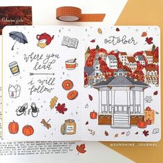 an open notebook with autumn illustrations and writing on the cover, along with other items