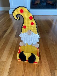 a lego figurine made to look like a giraffe in a box