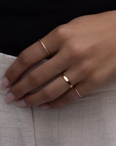 The perfect pinky ring. Dainty yet durable, this piece is stunning. Beautiful by itself, even better in a stack. Solid 14k gold. 5 Natural bright white diamonds. Custom made to order, final sale. Please allow 4-7 business days for production. Also available in 14k rose gold, email info@belladaar.com to order. Cute Dainty Rings, Barbie Sets, Dainty Rings, Hair Cuffs, Chain Anklet, Ring Dainty, Pinky Ring, Dainty Ring, White Diamonds