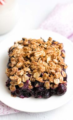 the ultimate healthy blueberry crisp on a white plate