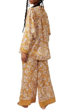 Make bedtime a bit more boho in flowery pajamas that live up to their dreamy designation. 28 1/2" to 31" top length; 28" inseam; 32" leg opening; 14" front rise; 17" back rise (size Medium) Top has spread collar; long sleeves 100% polyester Hand wash, line dry Imported Spring Matching Set Sleepwear, Floral Print Sleepwear For Pajama Party, Floral Print Sleepwear With Relaxed Fit Long Pants, Floral Print Relaxed Fit Pajamas, Floral Print Relaxed Fit Long Sleepwear Pants, Floral Print Sleepwear Long Pants For Loungewear, Floral Print Sleepwear With Relaxed Fit For Bedtime, Floral Print Relaxed Fit Sleepwear For Bedtime, Relaxed Fit Floral Print Sleepwear For Bedtime