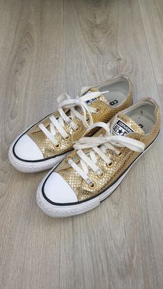 Converse all star made in Vietnam  Beautiful women's genuine leather sneakers  Gold color  Very good condition to excellent condition ( only has a wipe on right shoe, see last picture) Size EU-36 Insole length 22.5cm/ 8,7/8inches Insole width 7.5cm/ 2,7/8inches Gold Leather Low-top Sneakers, Gold High-top Sneakers With Rubber Sole, Gold High-top Sneakers With Vulcanized Sole, Gold Leather Sneakers With Laces, Gold Leather Sneakers, Gold Slip-on Sneakers With Rubber Sole, Gold Low-top Sneakers With Laces, Gold Leather Slip-on Sneakers, Gold Sneakers With Round Toe And Laces