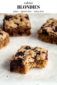 chocolate chip cookie bars sitting on top of white paper